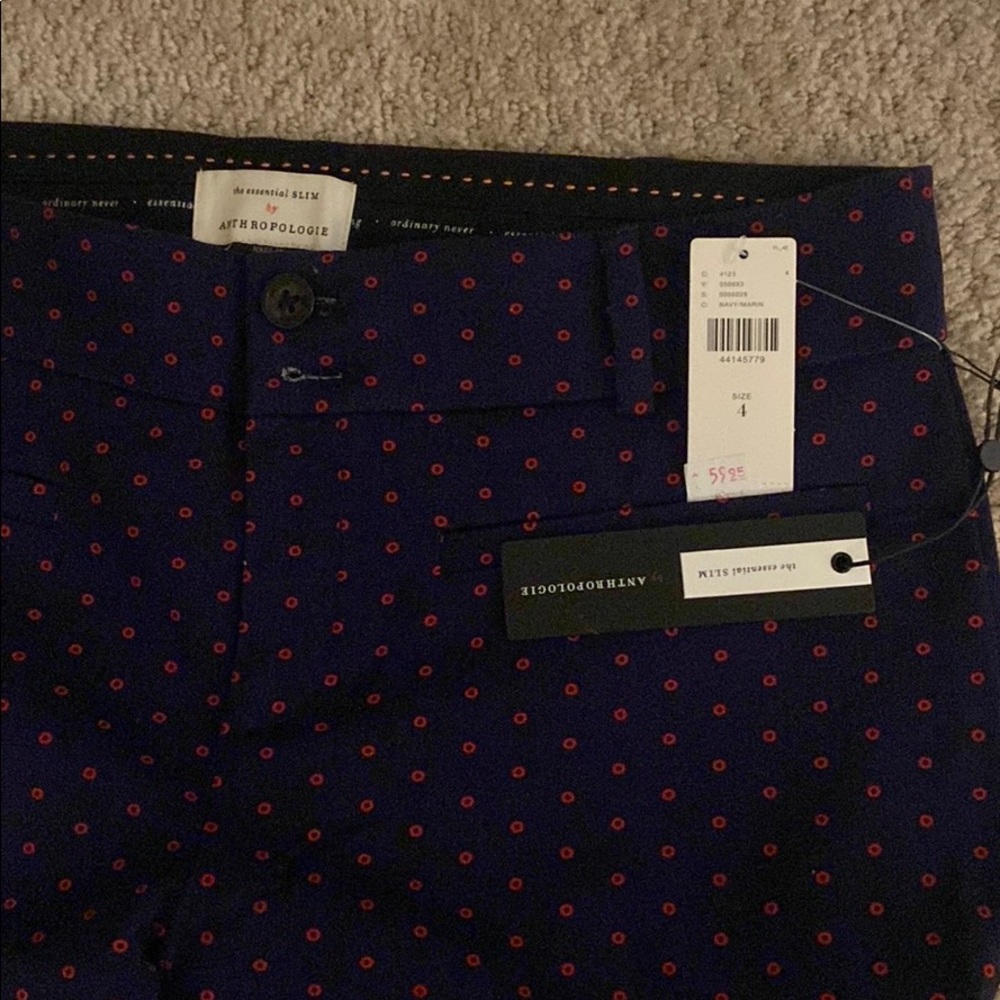 Navy pants with red dots